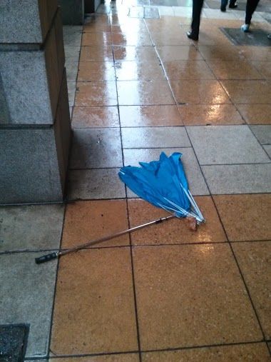 An umbrella destroyed by the high winds