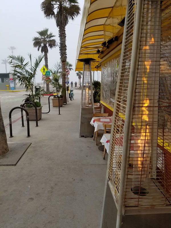 The warm glow of the space heaters at The Terrace at the end of Washington Blvd by the beach feels good on a foggy Monday morning.