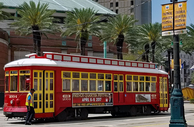 Streetcar on Canal Street advertising the French Quarter Fest