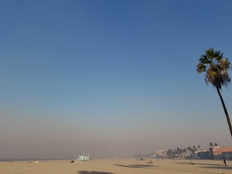 The smoke from the massive fires up towards Ventura County is thick on the beach in Venice. 