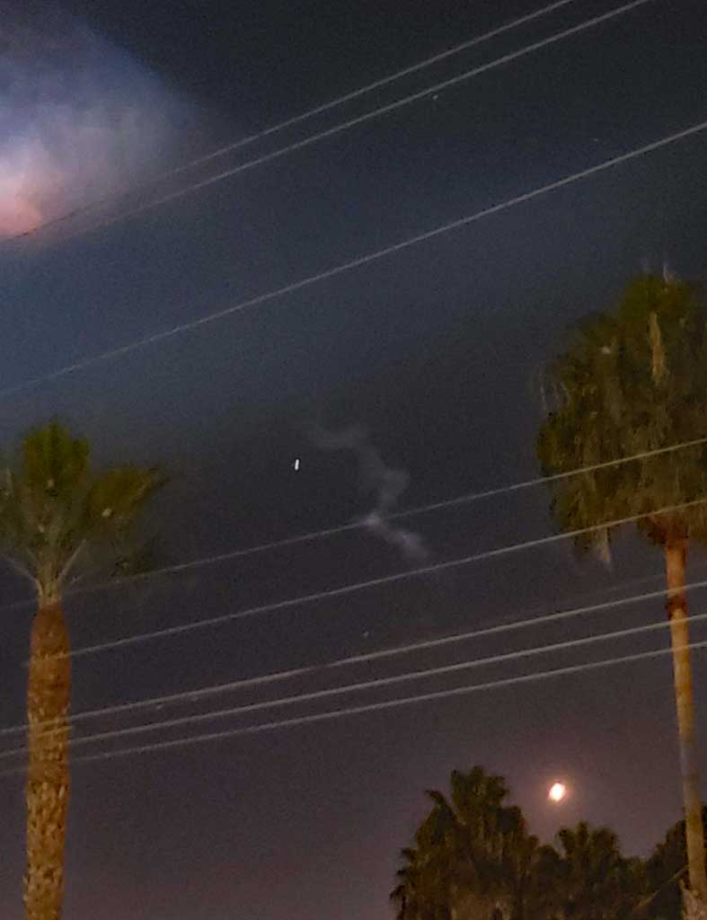 The bright light in the lower part of this image is the booster rocket on the way to land back at Vandenberg AFB.