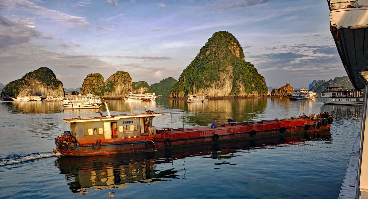 Early morning is the time when the re-fueling barges comes around and refuels the Djonks for another day in Ha Long bay.