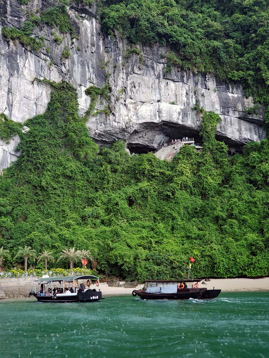 Tenders carrying visitors to the cave coming into the harbor during a light rain.