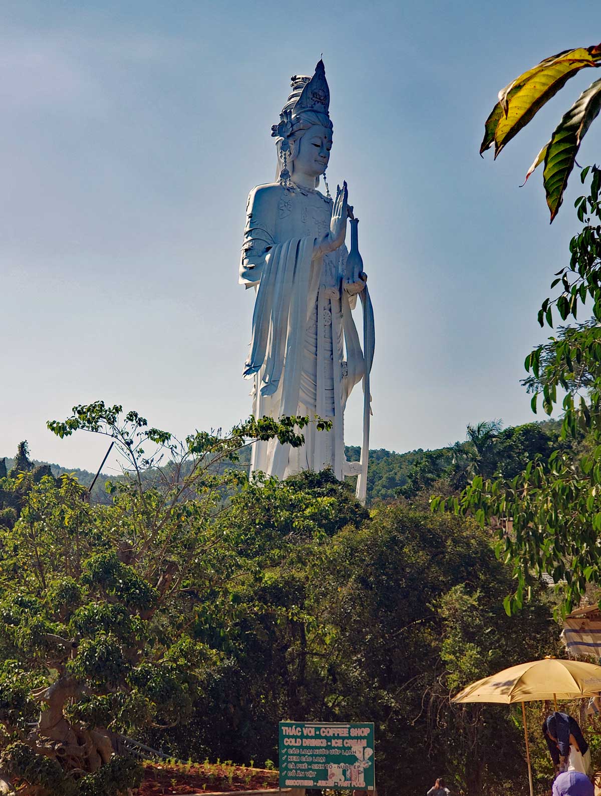 The big female Buddha sits above the falls at the Pagoda.